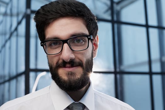 Head shot portrait close up smiling confident businessman wearing glasses and suit