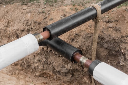 Repair of the water line of the heating main pipe in the ground trench pipeline at the construction site work industry.