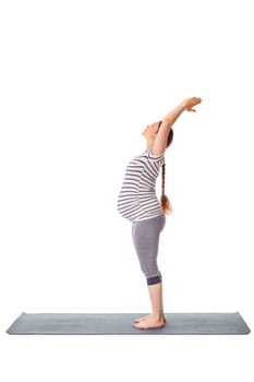 Pregnancy yoga exercise - pregnant woman doing yoga asana Tadasana Mountain pose isolated on white background