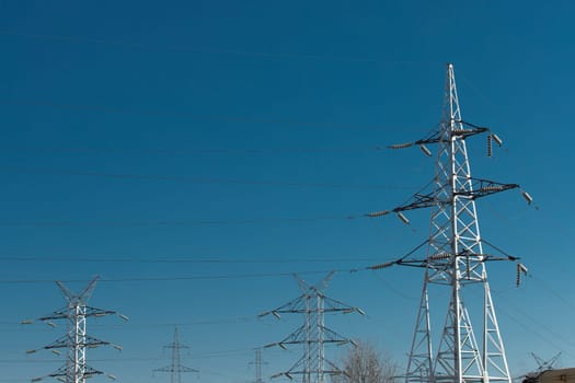 Electricity voltage high energy power technology electrical tower industry line electric blue sky.