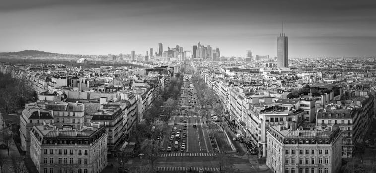 Black and white Paris cityscape panorama with view to La Defense metropolitan district, France. Champs-Elysee avenue, beautiful parisian architecture, historic buildings and landmarks on the horizon