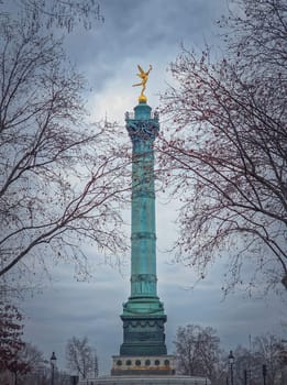 July Column (Colonne de Juillet) with the winged Spirit of Freedom (Génie de la Liberté) on top, located in the center of the Place de la Bastille, Paris, France.