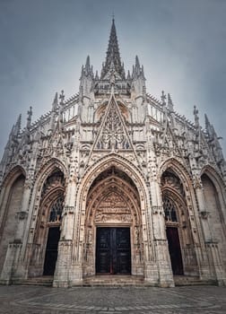Outdoor facade view of Saint Maclou Church of Rouen in Normandy, France. Flamboyant gothic architectural style