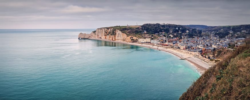 Wonderful panoramic view to the Etretat village and beach resort from the famous Falaise d'Aval cliffs in Normandy, France