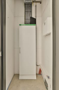 a white refrigerator freezer in the corner of a room that is being remodeled and ready to be used for storage