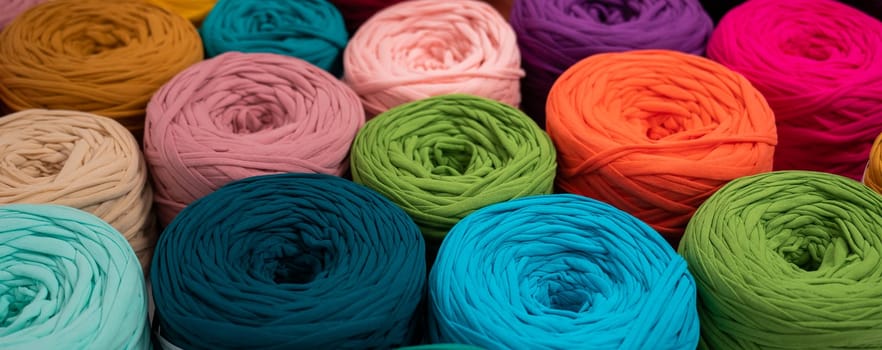 Close-up of multi-colored cotton skeins. Shop assortment for handmade.