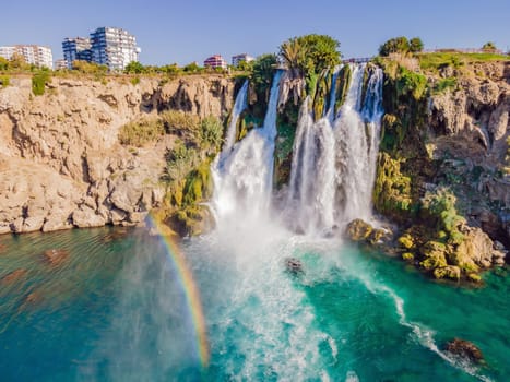 Lower Duden Falls drop off a rocky cliff falling from about 40 m into the Mediterranean Sea in amazing water clouds. Tourism and travel destination photo in Antalya, Turkey. Turkiye