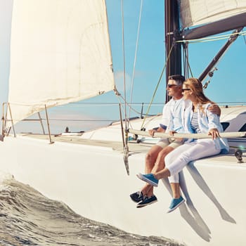 Cruising off to paradise. a couple enjoying a boat cruise out on the ocean