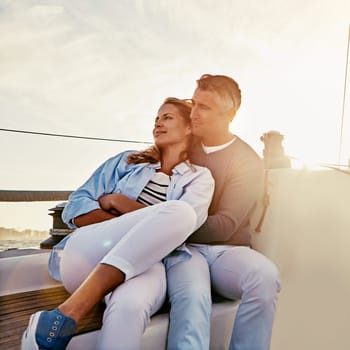 Live for the moments you cant put into words. a couple enjoying a boat cruise out on the ocean