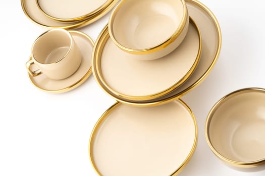 A Set of light brown ceramic plate and cup on a white background