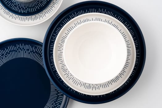 A set of blue and white luxury ceramic kitchen utensils on a white background