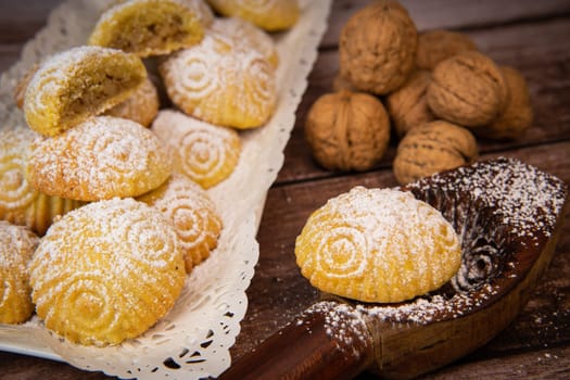 Traditional eid maamoul or mamoul cookies with dates, nuts, and jam, Arabic sweets for Aid al-Fitr and easter, High quality photo