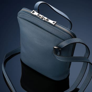 A closeup shot of a luxury blue leather bag