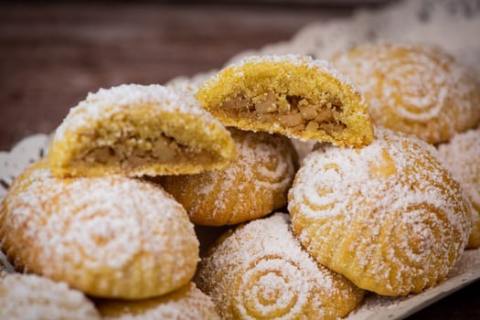 Traditional eid maamoul or mamoul cookies with dates, nuts, and jam, Arabic sweets for Aid al-Fitr and easter, High quality photo