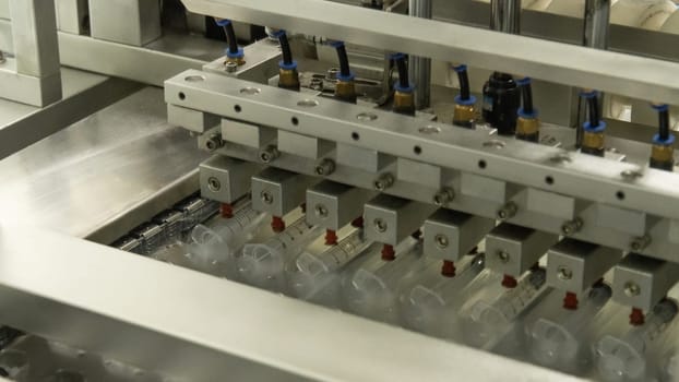 A closeup of the production of medical syringes