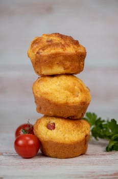 Savory muffin with ham and cheese on blue background, High quality photo