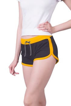 A female wearing sports clothes with short shorts