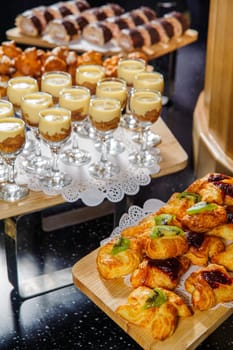 A vertical shot of a buffet table with desserts and sweets