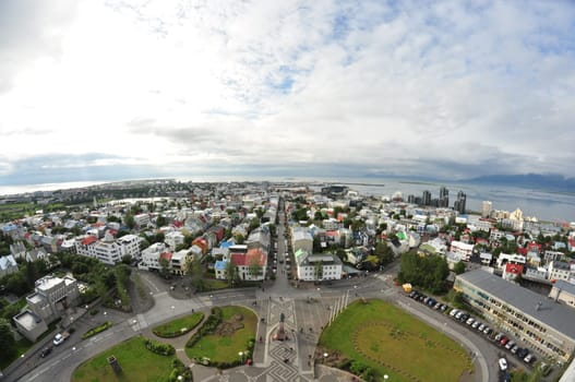 Aerial view of colorful buildings and lush greenery of Reykjavik, Iceland