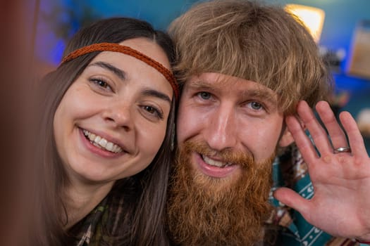 POV of family marriage hippie couple man woman taking selfie vlog social media videoblog, communicating with followers laughing looking to camera sharing news, call online. Husband and wife together