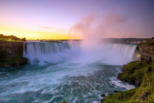Niagara falls between Canada and United States of America at sunset