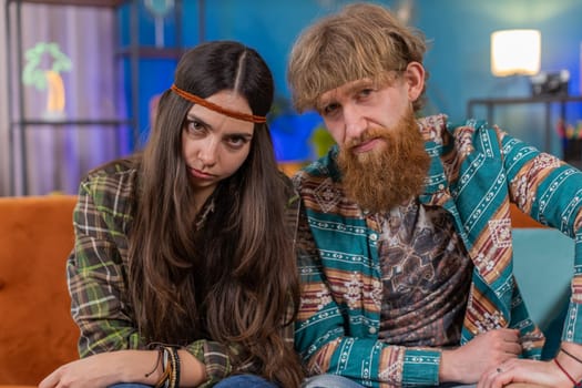 Displeased upset family marriage hippie couple man woman reacting to unpleasant awful idea, dissatisfied with bad quality, wave hand, shake head No, dismiss idea, dont like proposal. Husband and wife