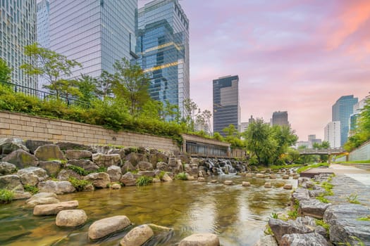 Cheonggyecheon, a modern public recreation space in downtown Seoul, South Korea at twilight