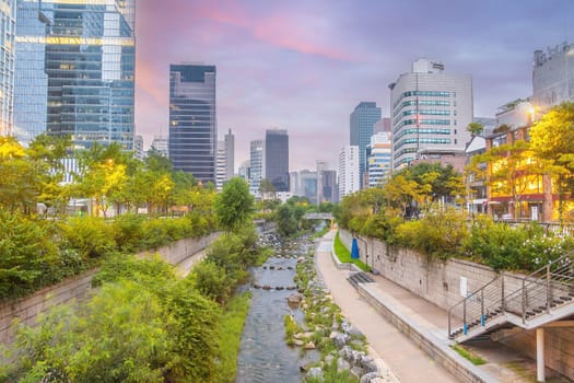 Cheonggyecheon, a modern public recreation space in downtown Seoul, South Korea at twilight
