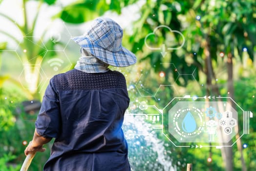 Smart farm digital icon and futuristic AI data infographic of Asian woman gardener watering the lawn plants and trees in agriculture garden for fresh and growth at outdoors countryside