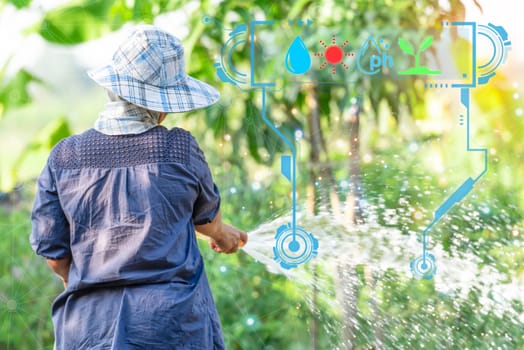 Smart farm digital icon and futuristic AI data infographic of Asian woman gardener watering the lawn plants and trees in agriculture garden for fresh and growth at outdoors countryside
