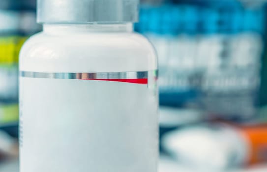 Close up view of white jar with pills, copy space