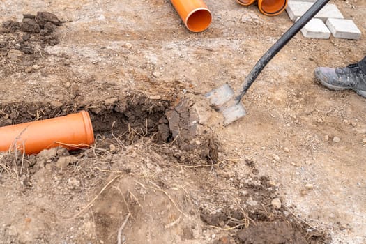 plastic pvc waste sewer pipe in the ground. High quality photo