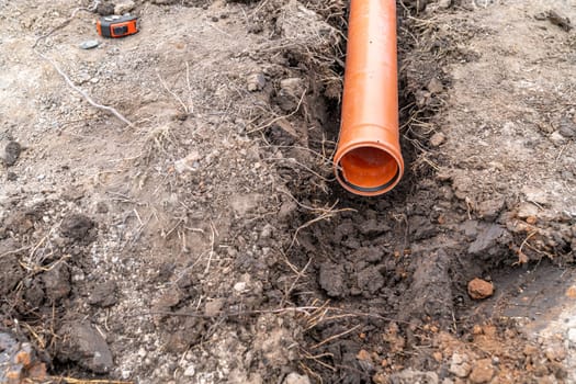 plastic pvc waste sewer pipe in the ground. High quality photo
