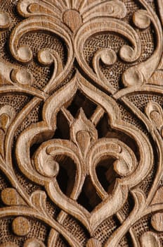 A close-up of vintage oriental artistic wood carving. Central Asia, Uzbekistan