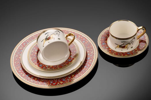 A closeup shot of luxury ceramic tableware isolated on the black background