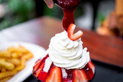 Bingsu or Bingsoo (Patbingsu) is a popular Korean shaved ice dessert with sweet toppings that may include chopped fruit, condensed milk, fruit syrup, and varieties with ingredients