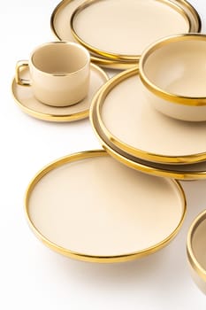 A Set of light brown ceramic plate and cup on a white background