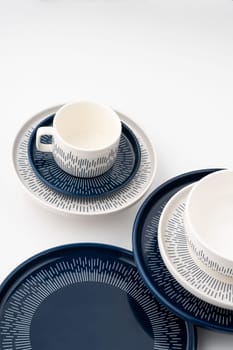 A set of blue and white luxury ceramic kitchen utensils on a white background