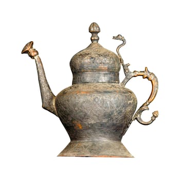 An antique metal teapot with artistic chasing and engraving on a white background