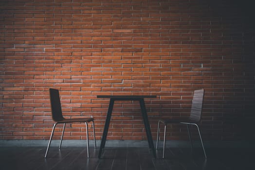 Cafe or restaurant in balcony view decorate with red brick wall and table chairs set for seating relax