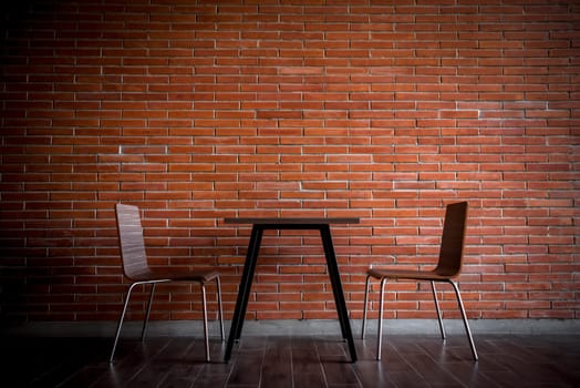 Cafe or restaurant in balcony view decorate with red brick wall and table chairs set for seating relax