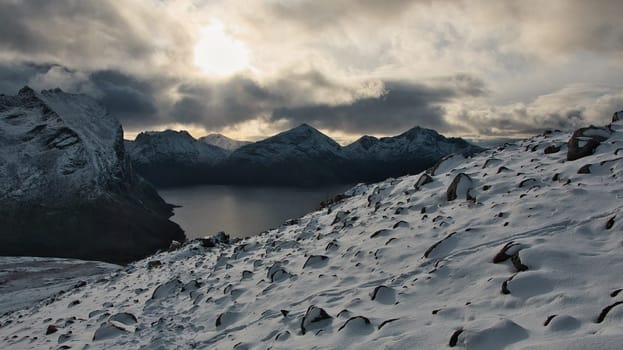 Beautiful view from a steep cliff of a mountain on the coastline of Brosmetinden, Norway