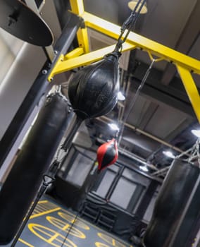 A vertical closeup of a boxing punch bag in the sports complex
