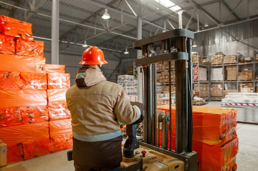 A back shot of a worker in a warehouse