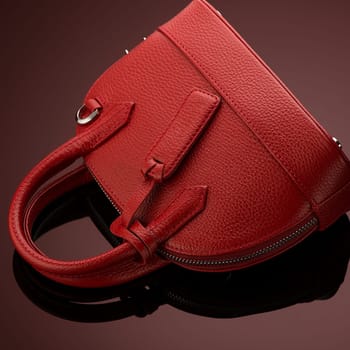 A closeup shot of a luxury red leather bag
