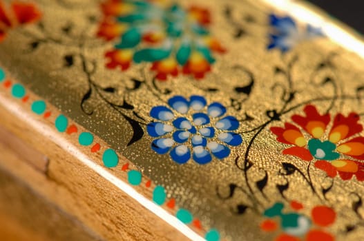 A closeup of a colorful artistic painting on a box. Central Asia, Uzbekistan