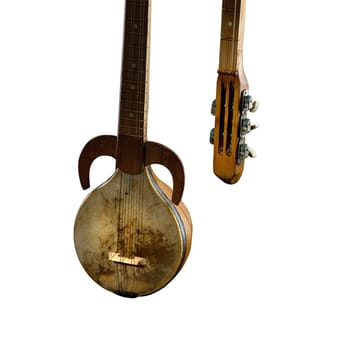 An ancient Asian stringed musical instrument on a white background