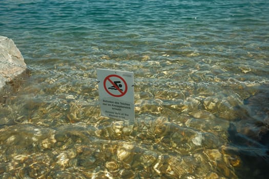 Crystal clear blue water at the Asitz lake in the Leoganger mountains, Austria