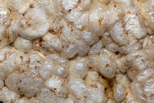 A texture of dry round cereal cakes extreme close-up, macro view