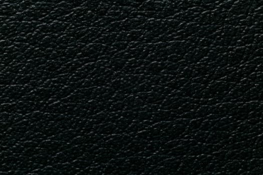 Black leatherette texture, eco-leather, extreme close-up macro view